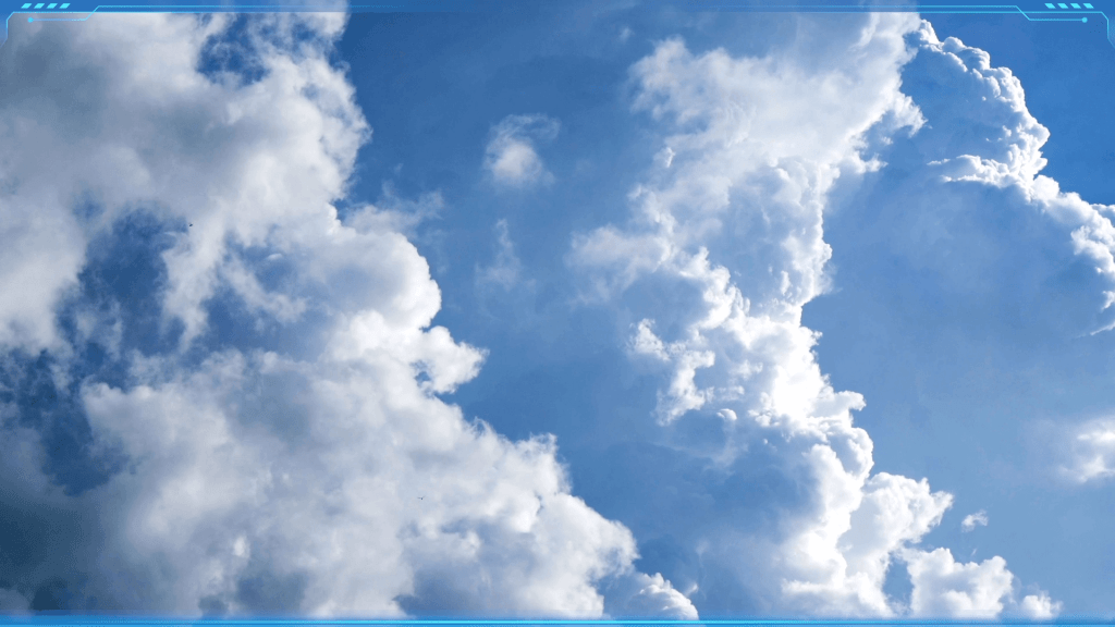 Large, white cumuliform cloud formations set against a bright blue sky, formed from tiny water droplets or ice crystals.